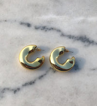 sandy hoops gold plated side on marble background