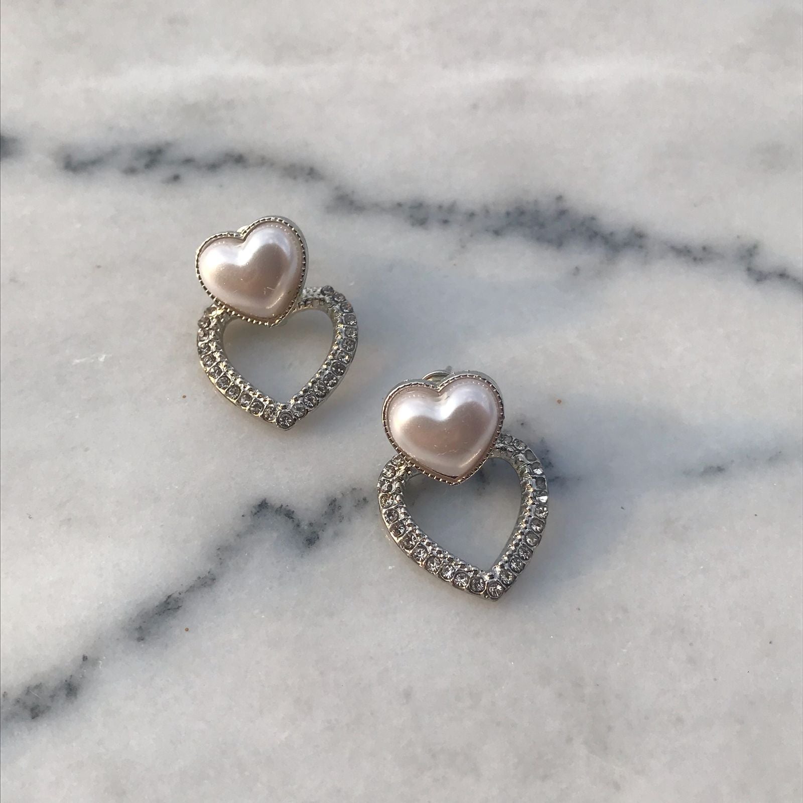 MADDY studs on marble background
