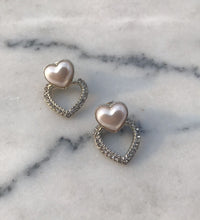 MADDY studs on marble background