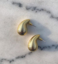 Dove studs side on marble background